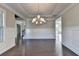 Bright dining room featuring hardwood floors and chandelier at 1190 Smithwell Pt, Kennesaw, GA 30152