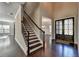 Two-story foyer with hardwood floors and staircase at 1190 Smithwell Pt, Kennesaw, GA 30152
