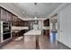 Modern kitchen, granite countertops, dark wood cabinets at 1190 Smithwell Pt, Kennesaw, GA 30152