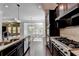 Open concept kitchen with stainless steel appliances and island at 1190 Smithwell Pt, Kennesaw, GA 30152