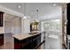Island kitchen features granite countertops and breakfast bar at 1190 Smithwell Pt, Kennesaw, GA 30152