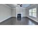 Living room with hardwood floors and a fireplace at 1190 Smithwell Pt, Kennesaw, GA 30152