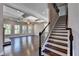 Elegant staircase with dark wood and wrought iron railing at 1190 Smithwell Pt, Kennesaw, GA 30152