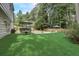 Lush backyard with patio seating and large pool, perfect for outdoor entertaining at 5371 Tall Oak Dr, Marietta, GA 30068