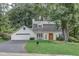 Charming home with a well-manicured lawn, mature trees, and a welcoming, classic facade at 5371 Tall Oak Dr, Marietta, GA 30068