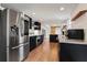 Updated kitchen with stainless steel appliances and light oak hardwood floors at 5371 Tall Oak Dr, Marietta, GA 30068
