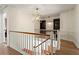 Spacious upstairs hall with built-in shelving and hardwood floors at 5371 Tall Oak Dr, Marietta, GA 30068