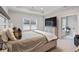 Relaxing bedroom with a tray ceiling, large window, and soft, neutral decor at 6320 Halcyon Garden Dr, Alpharetta, GA 30005