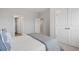 Bright bedroom showcasing a view into an adjacent room with large closets at 6320 Halcyon Garden Dr, Alpharetta, GA 30005