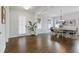 Bright dining room with hardwood floors and an elegant chandelier at 6320 Halcyon Garden Dr, Alpharetta, GA 30005