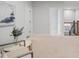 Hallway area with carpet, wall art, and open doors at 6320 Halcyon Garden Dr, Alpharetta, GA 30005