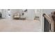 Hallway area with carpet, decorative chair, and multiple room entryways at 6320 Halcyon Garden Dr, Alpharetta, GA 30005