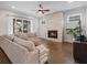 Inviting living room with a fireplace, hardwood floors, and ample natural light at 6320 Halcyon Garden Dr, Alpharetta, GA 30005