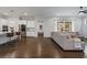 Open floorplan features a living room, kitchen with island, and stainless steel appliances at 6320 Halcyon Garden Dr, Alpharetta, GA 30005