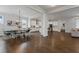 Open concept living space features a dining area, views to kitchen, and connections to the living room at 6320 Halcyon Garden Dr, Alpharetta, GA 30005