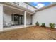 Inviting covered outdoor patio with a sliding glass doors, seating area, and view of the backyard at 6320 Halcyon Garden Dr, Alpharetta, GA 30005