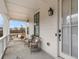 Covered porch featuring comfortable seating and a stylish hanging chair at 6320 Halcyon Garden Dr, Alpharetta, GA 30005