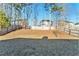 Fenced backyard with level yard and mature trees at 1013 Bluecoat Cir, Hampton, GA 30228