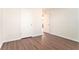 Well-lit bedroom featuring wood-look floors and closet at 1013 Bluecoat Cir, Hampton, GA 30228