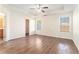 Bright bedroom with hardwood floors and two windows at 1013 Bluecoat Cir, Hampton, GA 30228