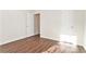 Spacious bedroom featuring wood-look floors and an open layout at 1013 Bluecoat Cir, Hampton, GA 30228