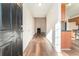 Bright entryway with hardwood floors and views into living room and kitchen at 1013 Bluecoat Cir, Hampton, GA 30228