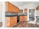 Kitchen with wood cabinets, tile backsplash and stainless steel appliances at 1013 Bluecoat Cir, Hampton, GA 30228