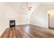 Spacious living room with hardwood floors and a fireplace at 1013 Bluecoat Cir, Hampton, GA 30228