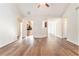 Open living room with hardwood floors and views of kitchen at 1013 Bluecoat Cir, Hampton, GA 30228