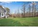 Private backyard with grassy lawn and wooded area at 302 N Brooke Dr, Canton, GA 30115