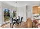 Bright breakfast nook with glass table and wooded view at 302 N Brooke Dr, Canton, GA 30115