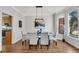 Formal dining room with hardwood floors, large windows, and chandelier at 302 N Brooke Dr, Canton, GA 30115