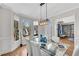 Bright dining room with hardwood floors, bay window and chandelier at 302 N Brooke Dr, Canton, GA 30115