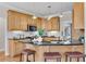 Modern kitchen featuring granite countertops, a breakfast bar with seating, and stainless steel appliances at 302 N Brooke Dr, Canton, GA 30115