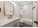 Bathroom with white vanity, a tub, and white tile shower at 305 Gordon Ne Ave, Atlanta, GA 30307