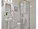 Bathroom featuring a pedestal sink, tiled floors, and glass enclosed walk-in shower at 725 Oakland Se Ave, Atlanta, GA 30315