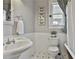 Bathroom featuring patterned tile floors, a sink, a toilet, tub and wainscotting walls at 725 Oakland Se Ave, Atlanta, GA 30315