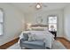 Serene bedroom with hardwood floors, neutral decor, and plenty of natural light at 725 Oakland Se Ave, Atlanta, GA 30315