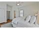 Bright bedroom with white walls and a ceiling fan above the bed and access to ensuite bathroom at 725 Oakland Se Ave, Atlanta, GA 30315