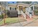 Quaint home with a welcoming porch and brick stairs leading to the entrance at 725 Oakland Se Ave, Atlanta, GA 30315