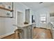 Bright kitchen featuring stainless steel appliances, hardwood floors, and a door leading to the backyard at 725 Oakland Se Ave, Atlanta, GA 30315