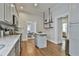 Open kitchen featuring stainless steel appliances, an island, and a view into the dining room at 725 Oakland Se Ave, Atlanta, GA 30315