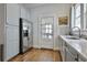 Well-lit kitchen with stainless steel appliances, sleek countertops, and hardwood floors at 725 Oakland Se Ave, Atlanta, GA 30315