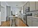 Charming kitchen with stainless steel appliances, custom cabinets, an island, and ample counter space at 725 Oakland Se Ave, Atlanta, GA 30315