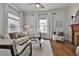 Bright living room with stylish decor and a cozy fireplace as its focal point at 725 Oakland Se Ave, Atlanta, GA 30315