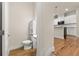 Half bathroom featuring tile floors adjacent to the kitchen at 1284 Park Bench Pl, Mableton, GA 30126