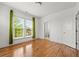 Bright room with hardwood floors, view of bathroom, and double windows at 1284 Park Bench Pl, Mableton, GA 30126