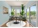 Cozy dining area with lots of natural light from large windows and a sliding door at 1284 Park Bench Pl, Mableton, GA 30126