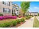 Attractive townhouses with landscaping, sidewalks, and green trees at 1284 Park Bench Pl, Mableton, GA 30126