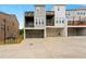 Back of townhouse showing garage doors and upper floor decks at 1284 Park Bench Pl, Mableton, GA 30126